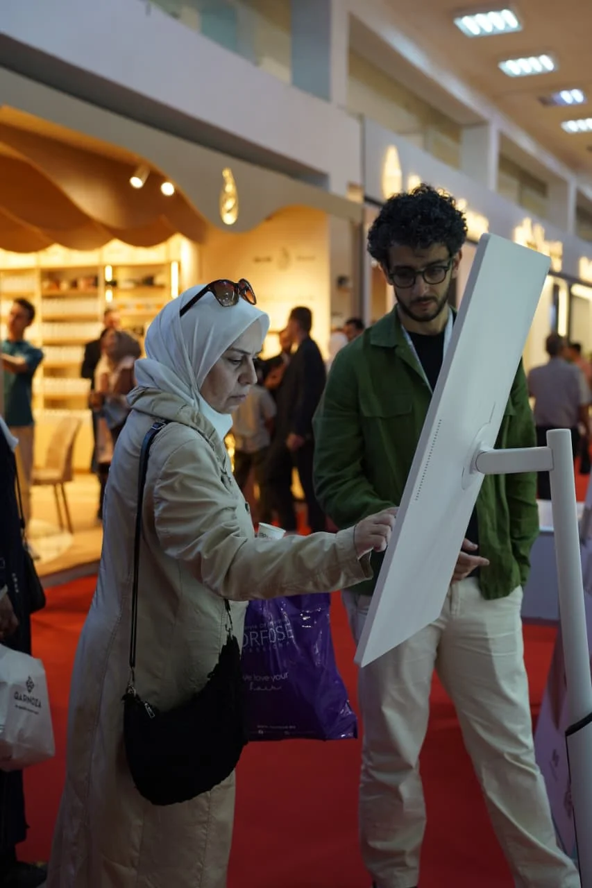 Visitor playing the Spin-Wheel game at the expo booth
